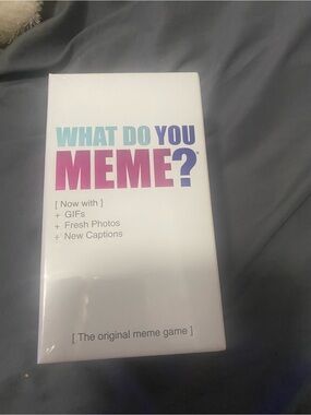 Source Unknown What Do You Meme? Game - White with Pink and Blue Logo